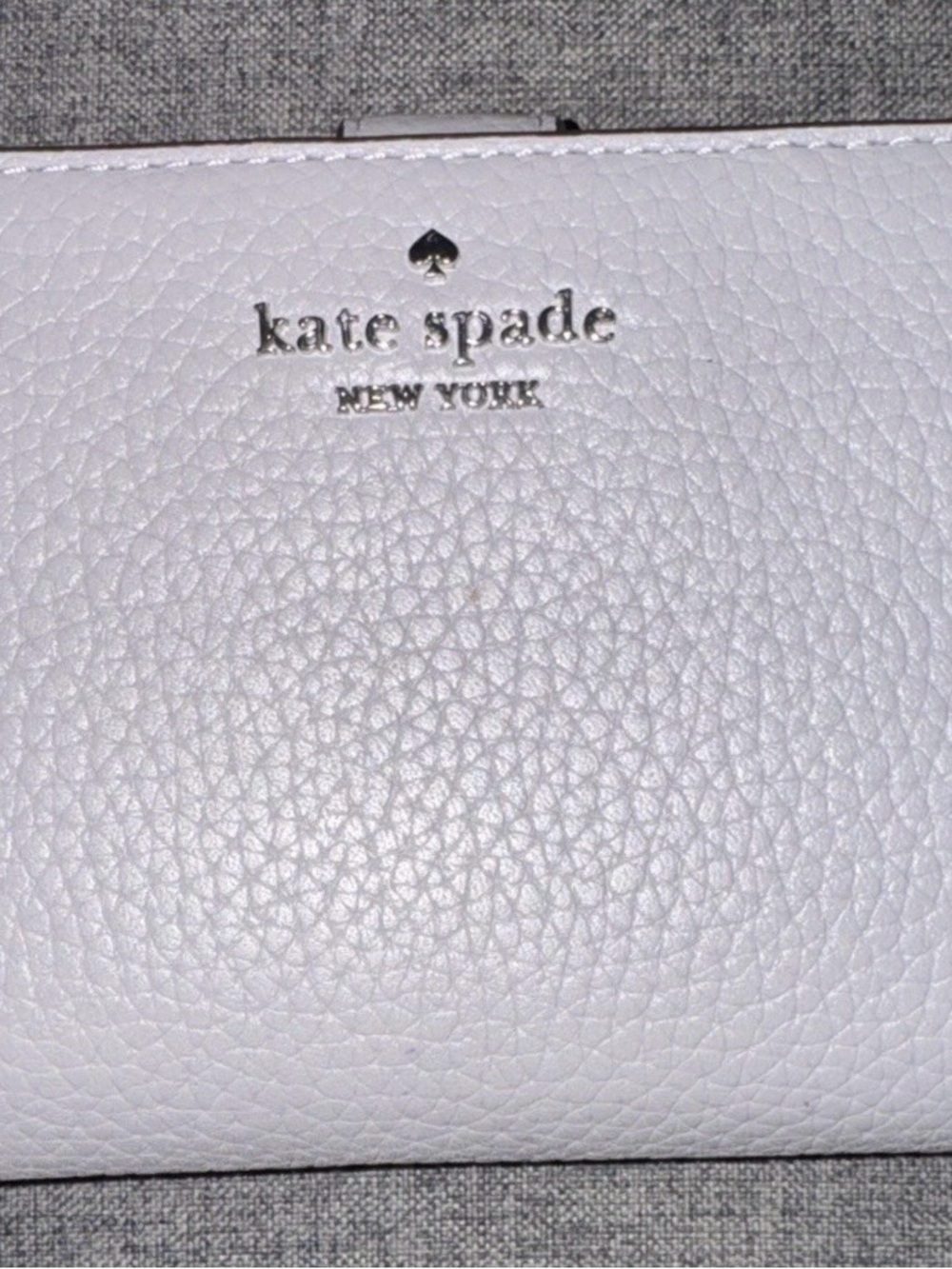 kate spade White Pebbled Leather Zip Wallet with Silver Logo